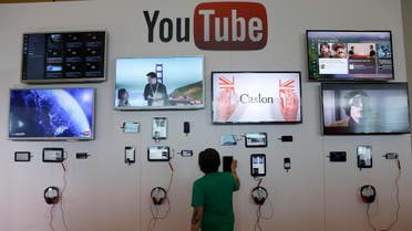 A man looks at a device a the YouTube booth at Google I/O 2013 in San Francisco. (File: AP)