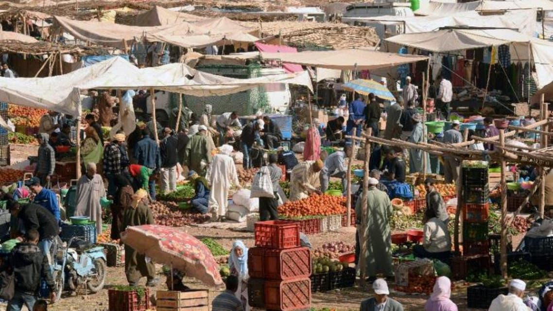 Moroccans shop in the local market in Tinghir, at the foot of the High Atlas and the heart of Morocco's Berber community on April 21 , 2014 (AFP)