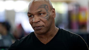 Former boxer Mike Tyson watches mixed martial arts fighter Ronda Rousey train during her workout, Wednesday, July 15, 2015, in Glendale, Calif. Rousey, the UFC bantamweight champion, will return to the octagon against Brazil’s unbeaten Bethe Correia at UFC 190 in Rio de Janeiro on Aug. 1. (AP Photo/Jae C. Hong)