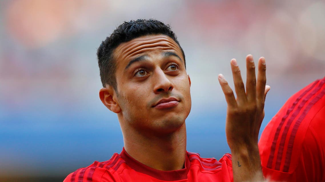 Bayern's Thiago from Spain gestures during a show training and team presentation for the upcoming German first division Bundesliga soccer season at the Allianz Arena in Munich, Germany, on Saturday, July 11, 2015. (AP Photo/Matthias Schrader)