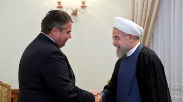 Iran's President Hassan Rouhani, right, shakes hands with the German Vice Chancellor and Economy Minister Sigmar Gabriel at the start of their meeting in Tehran, Iran, Monday, July 20, 2015. (AP)
