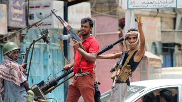 Fighters loyal to exiled President Abedrabbo Mansour Hadi, gesture as they drive through a street in the southern city of Aden on July 19, 2015.