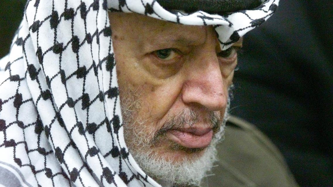 In this May 31, 2002 file photo photo Palestinian leader Yasser Arafat pauses during the weekly Muslim Friday prayers in his headquarters in the West Bank city of Ramallah. Yasser Arafat's body may be exhumed to allow for more testing of the causes of his death, the Palestinian president said Wednesday, July 4, 2012, after a Swiss lab said it found elevated levels of a radioactive isotope in belongings the Palestinian leader is said to have used in his final days. (AP Photo/Lefteris Pitarakis, File)