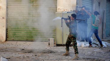 Libyan military soldiers fire their weapons during clashes with Islamic militias in Benghazi. Libya, virtually a failed state the past years, has provided a perfect opportunity for the Islamic State group to expand from its heartland of Syria and Iraq to establish a strategic stronghold close to European shores. (AP