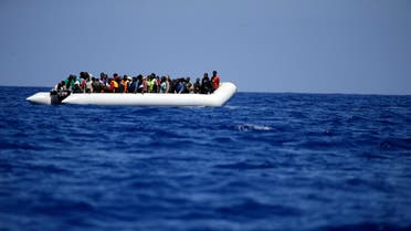 A rubber boat loaded of migrants is seen during a search and rescue mission in the mediterranean sea off the Libyan coasts, Italy, Tuesday, June 23, 2015. Hundreds of migrants were rescued on Tuesday by the Godetia Belgian Navy Vessel which is among a EU Navy Vessels fleet taking part in the Triton migrant rescue operations. (AP Photo/Gregorio Borgia)