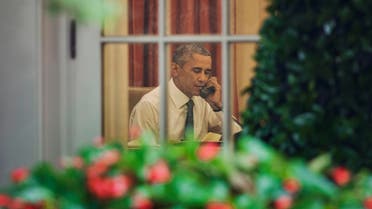 President Barack Obama is seen talking on the phone in the Oval Office of the White House in Washington, Friday, June 26, 2015. AP
