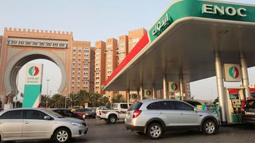 Vehicles wait to buy fuel at a petrol station on Wednesday, July 22, 2015, in Dubai, United Arab Emirates. UAE authorities plan to begin linking fuel prices to global prices starting Aug. 1. (AP)