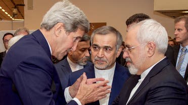 U.S. Secretary of State John Kerry (L) speaks with Hossein Fereydoun (C), the brother of Iranian President Hassan Rouhani, and Iranian Foreign Minister Javad Zarif (R), before the Secretary and Foreign Minister addressed an international press corps gathered at the Austria Center in Vienna, Austria, July 14, 2015. Iran and six major world powers reached a nuclear deal on Tuesday, capping more than a decade of on-off negotiations with an agreement that could potentially transform the Middle East, and which Israel called an "historic surrender". REUTERS/US State Department/Handout via Reuters