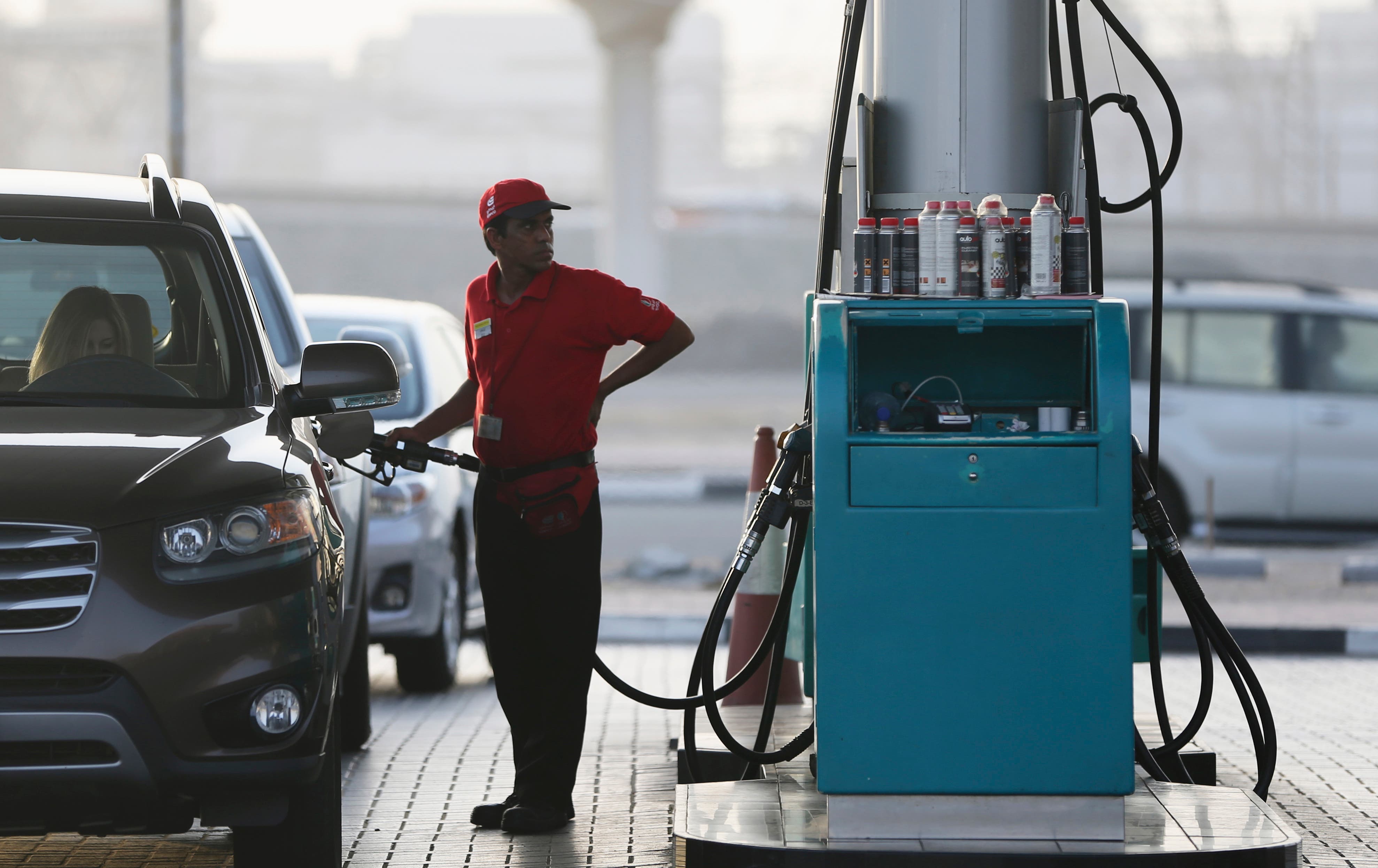 A petrol station staff member fills a gas tank on Wednesday, July 22, 2015, in Dubai, United Arab Emirates.  (AP)