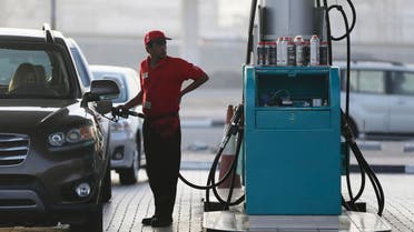 A petrol station staff member fills a gas tank on Wednesday, July 22, 2015, in Dubai, United Arab Emirates. (AP)