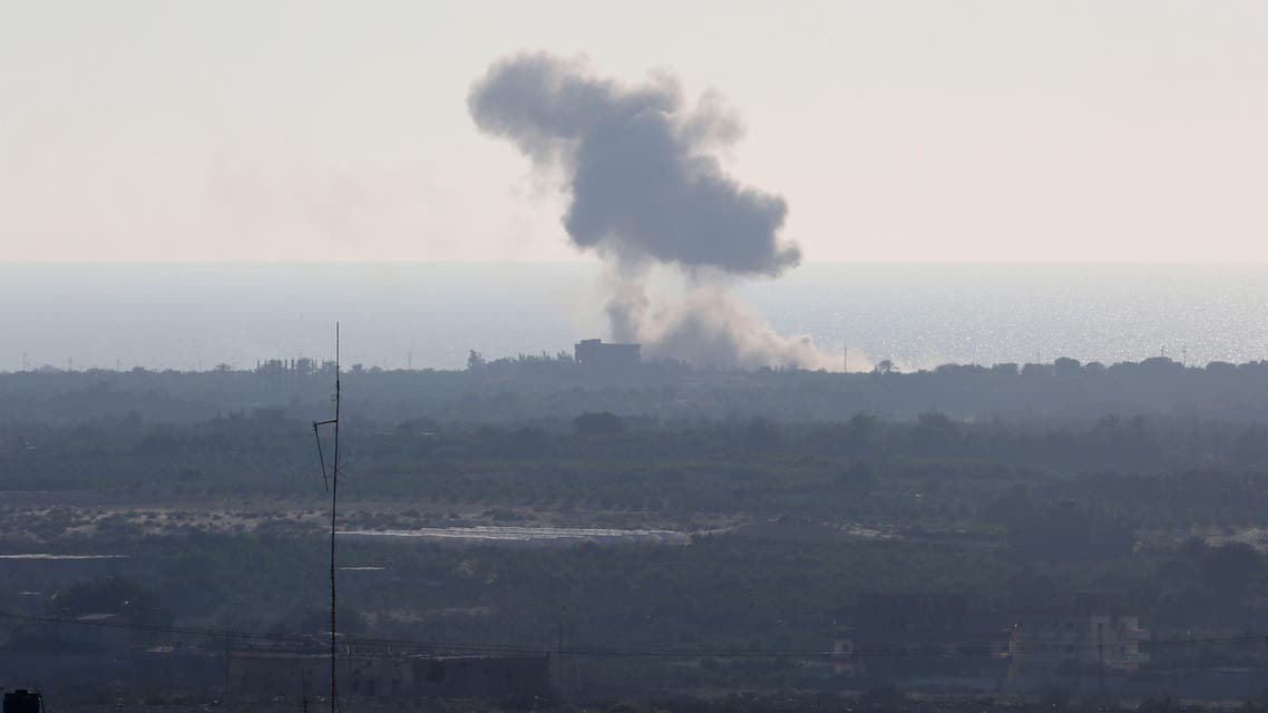 A picture taken from the Rafah border of the southern Gaza Strip with Egypt shows smoke billowing in Egypt's North Sinai on July 16, 2015. AP