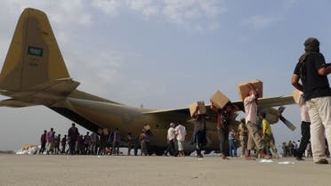 Workers unload aid shipment from a Saudi military cargo plane at the international airport of Yemen's southern port city of Aden July 23, 2015. (AP)