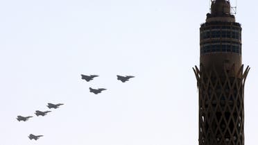 French-made Rafale fighter jets (on R) fly near Cairo Tower in central Cairo, Egypt, July 21, 2015. Dassault Aviation is raising Rafale fighter jet production in anticipation of further export orders, Chief Executive Eric Trappier said on Monday, as Egypt became the first country outside France to take delivery of the plane. REUTERS/Stringer