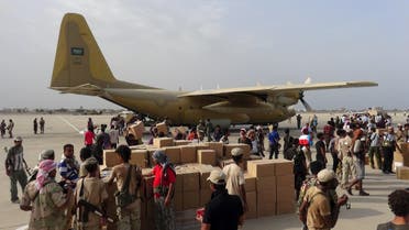 Workers and Southern Resistance fighters unload aid shipment from a Saudi military cargo plane at the international airport of Yemen's southern port city of Aden. Reuters 