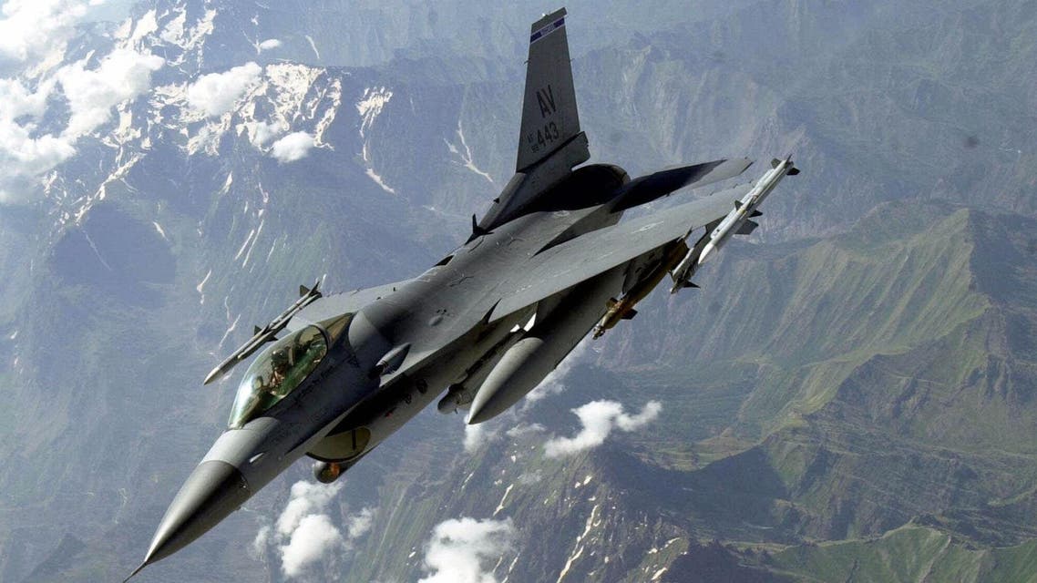 A U.S. F-16 flies over partly snow-covered mountains near the Turkey-Iraq border during a mission to patrol the no-fly zone in Iraq in this June 19, 2001 photo. AP
