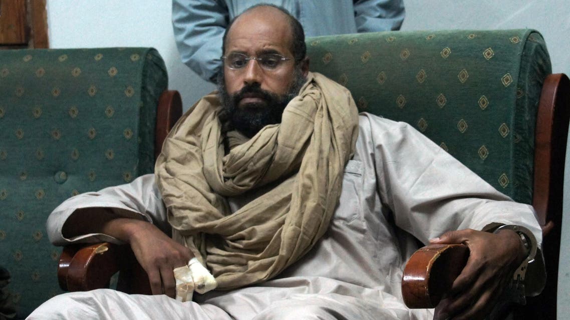 In this Saturday, Nov. 19, 2011 file photo, Seif al-Islam is seen after his capture in the custody of revolutionary fighters in Zintan, Libya