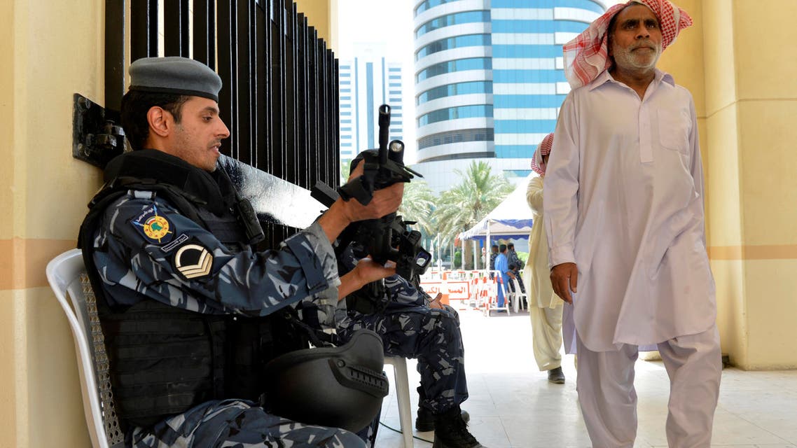 Kuwaiti police are on hand as worshippers arrive for Friday prayers at the Grand Mosque in Kuwait City on Friday, July 3, 2015, one week after a suicide attack by an ISIS sympathizer on Shiite worshippers. (AP)