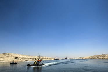  A picture taken on July 29, 2015 shows boats crossing the new waterway at the new Suez Canal in the Egyptian port city of Ismailia, east of Cairo. AFP
