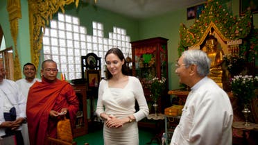 Angelina Jolie, center, is greeted by an Indian girl during a meeting with religious leaders from Myanmar Interfaith Group at a monastery Friday, July 31, 2015,