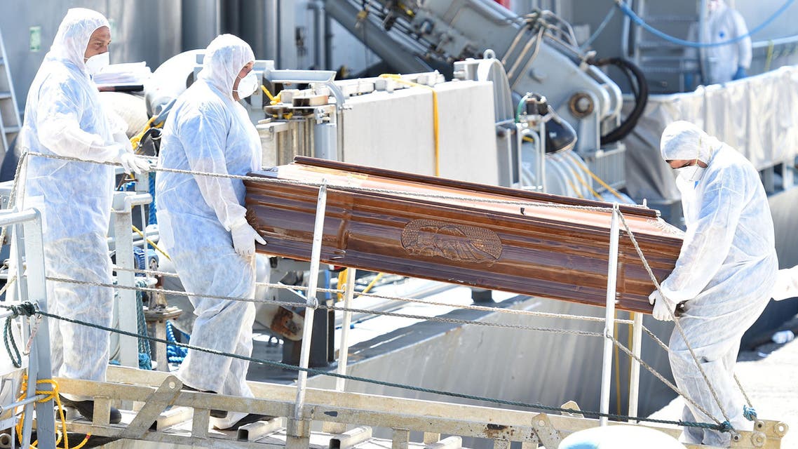 The coffin with the body of a migrants is disembarked from LE Niamh (P52), a Roisin Class large patrol vessel of the Irish Naval Service, at the Messina harbor in Sicily, Italy, Wednesday, July 29, 2015. AP