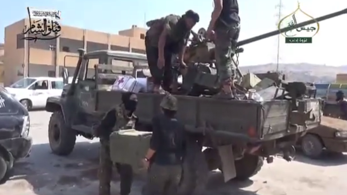 Syrian rebels seen loading supplies onto a truck in the northwestern Hama province (Video grab)