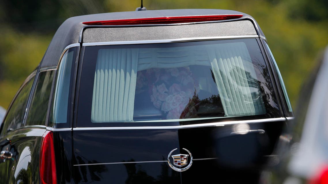 A hearse caring the casket of Bobbi Kristina Brown leaves her funeral service Saturday, Aug. 1, 2015, in Alpharetta, Ga.