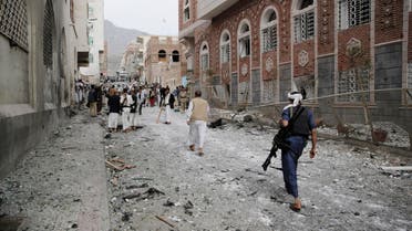 Shiite fighters known as Houthis gather at the site of a car bomb attack next to a Shiite mosque in Sanaa, Yemen, Wednesday, July 29, 2015. The car bomb exploded in Sanaa, next to a mosque belonging to the minority al-Bohra community, a Shiite sect, killing a few people and wounding several, Yemen's rebel-held Interior Ministry said in a statement. (AP Photo/Hani Mohammed)