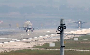 Turkish Air Force fighter planes land at Incirlik Air Base, on the outskirts of the city of Adana, southern Turkey, Thursday, July 30, 2015. After months of reluctance, Turkish warplanes last week started striking militant targets in Syria and agreed to allow the U.S. to launch its own strikes from Turkey's strategically located Incirlik Air Base. In a series of cross-border strikes, Turkey has not only targeted the IS group but also Kurdish fighters affiliated with forces battling IS in Syria and northern Iraq and Kurdistan Workers' Party, or PKK positions within Turkey. (AP Photo/Emrah Gurel)