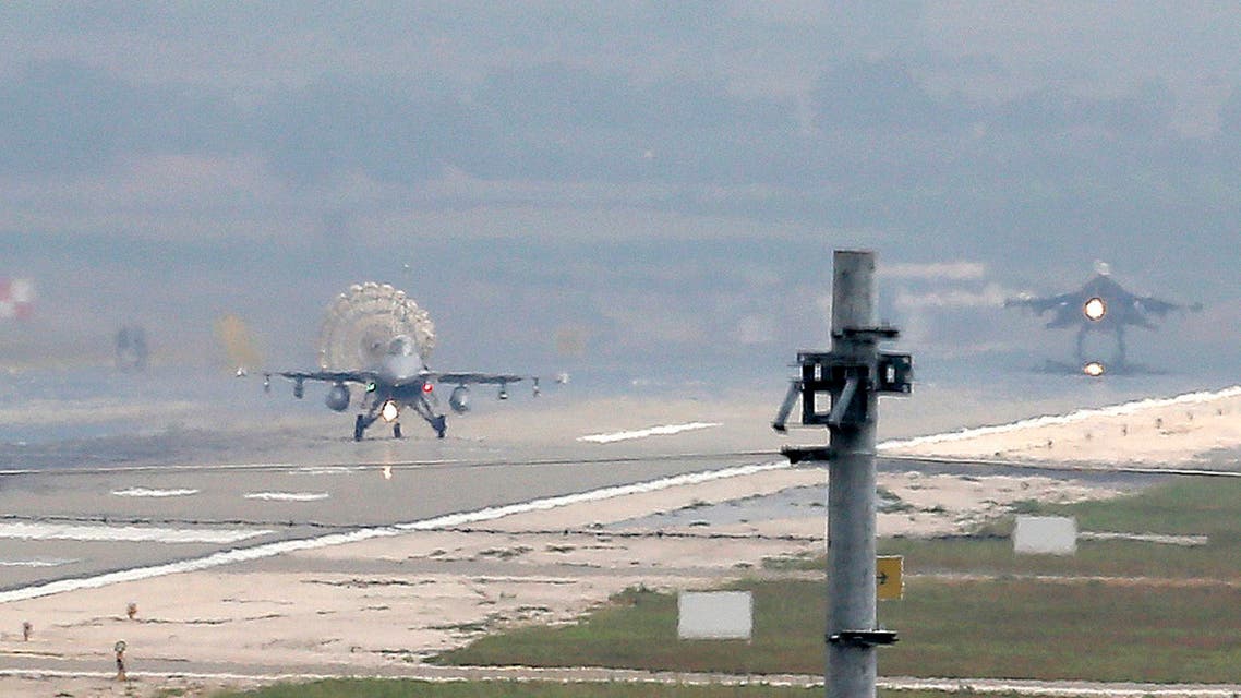 Turkish Air Force fighter planes land at Incirlik Air Base, on the outskirts of the city of Adana, southern Turkey, Thursday, July 30, 2015. After months of reluctance, Turkish warplanes last week started striking militant targets in Syria and agreed to allow the U.S. to launch its own strikes from Turkey's strategically located Incirlik Air Base. In a series of cross-border strikes, Turkey has not only targeted the IS group but also Kurdish fighters affiliated with forces battling IS in Syria and northern Iraq and Kurdistan Workers' Party, or PKK positions within Turkey. (AP Photo/Emrah Gurel)