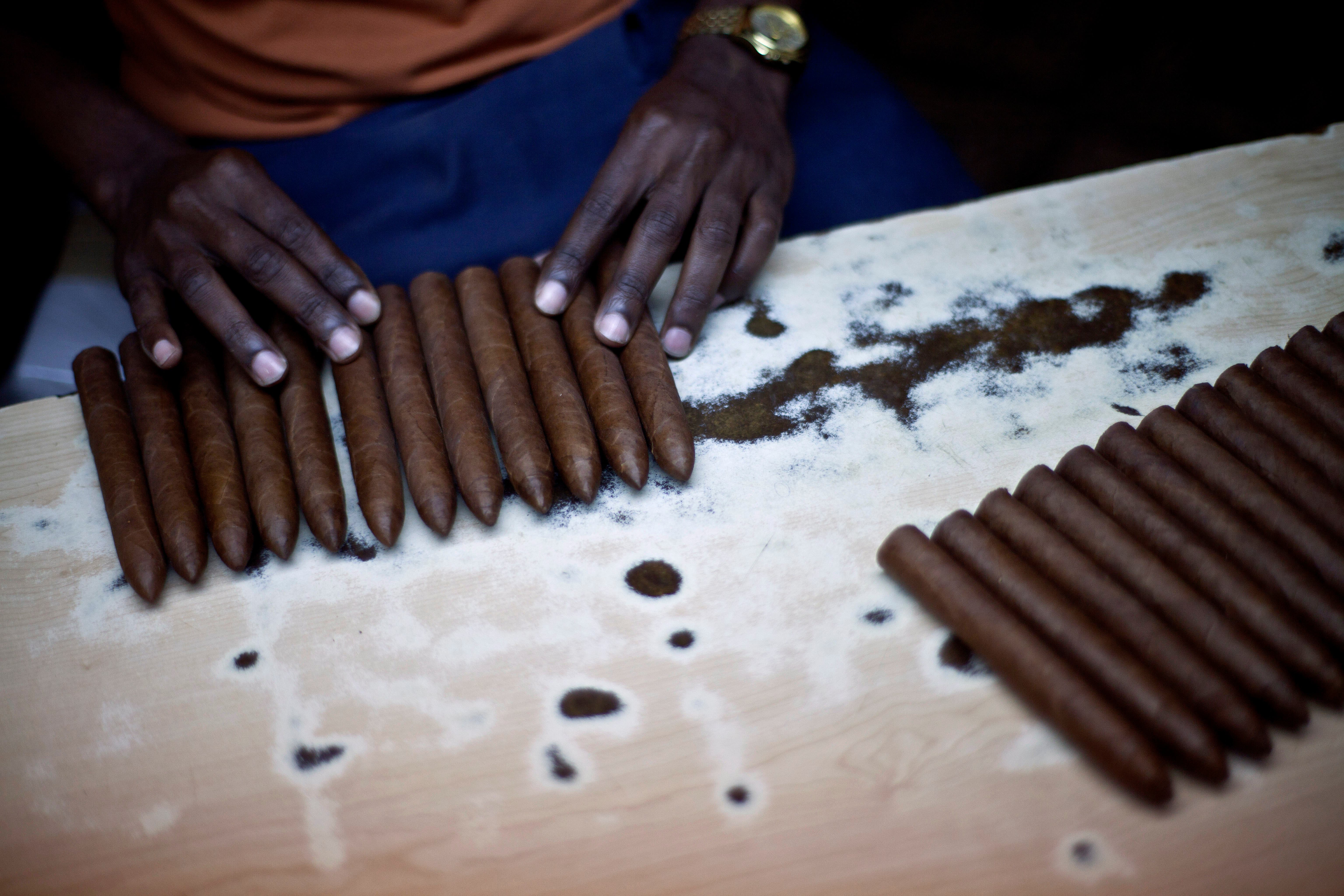 A worker selects cigars at the H. Upmann cigar factory, where people can take tours as part of the 15th annual Cigar Festival, in Havana, Cuba.  (AP)