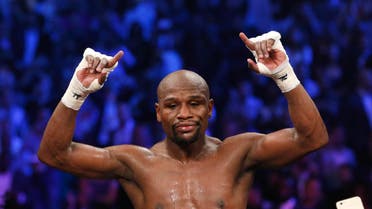  Floyd Mayweather Jr., celebrates his unanimous decision victory over Manny Pacquiao, from the Philippines, at the finish of their welterweight title fight on Saturday, May 2, 2015 in Las Vegas. (AP Photo/John Locher)