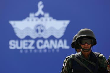 Egyptian special forces soldiers stand guard during the opening ceremony of the new section of the Suez Canal in Ismailia, Egypt, Thursday, Aug. 6, 2015. With much pomp and fanfare, Egypt on Thursday unveiled a major extension of the Suez Canal whose patron, President Abdel-Fattah el-Sissi, has billed as an historic achievement needed to boost the country’s ailing economy after years of unrest. (AP Photo/Hassan Ammar)