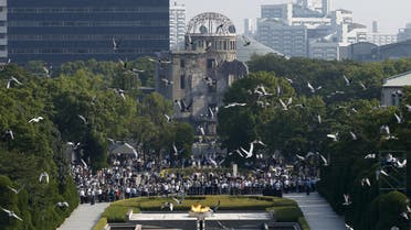 Doves fly over Peace Memorial Park with Atomic Bomb Dome in the background, at a ceremony in Hiroshima, western Japan, August 6, 2015, on the 70th anniversary of the atomic bombing of the city. Japan on Thursday marked the 70th anniversary of the attack on Hiroshima, where the U.S. dropped an atomic bomb on August 6, 1945, killing about 140,000 by the end of the year in a city of 350,000 residents. It was the world's first nuclear attack. The Atomic Bomb Dome, or Genbaku Dome, was the only structure left standing in this district of the city and has been preserved as a peace memorial. REUTERS/Toru Hanai