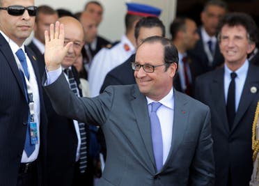 French President Francois Hollande greets journalists upon his arrival to attend the inauguration ceremony of the new section of the Suez Canal in Ismailia, Egypt, Thursday, Aug. 6, 2015. With much pomp and fanfare, Egypt on Thursday unveiled a major extension of the Suez Canal whose patron, President Abdel-Fattah el-Sissi, has billed as an historic achievement needed to boost the country’s ailing economy after years of unrest. (AP Photo/Amr Nabil)