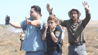 Photo of Palestinian men protecting Israeli policewoman goes viral 