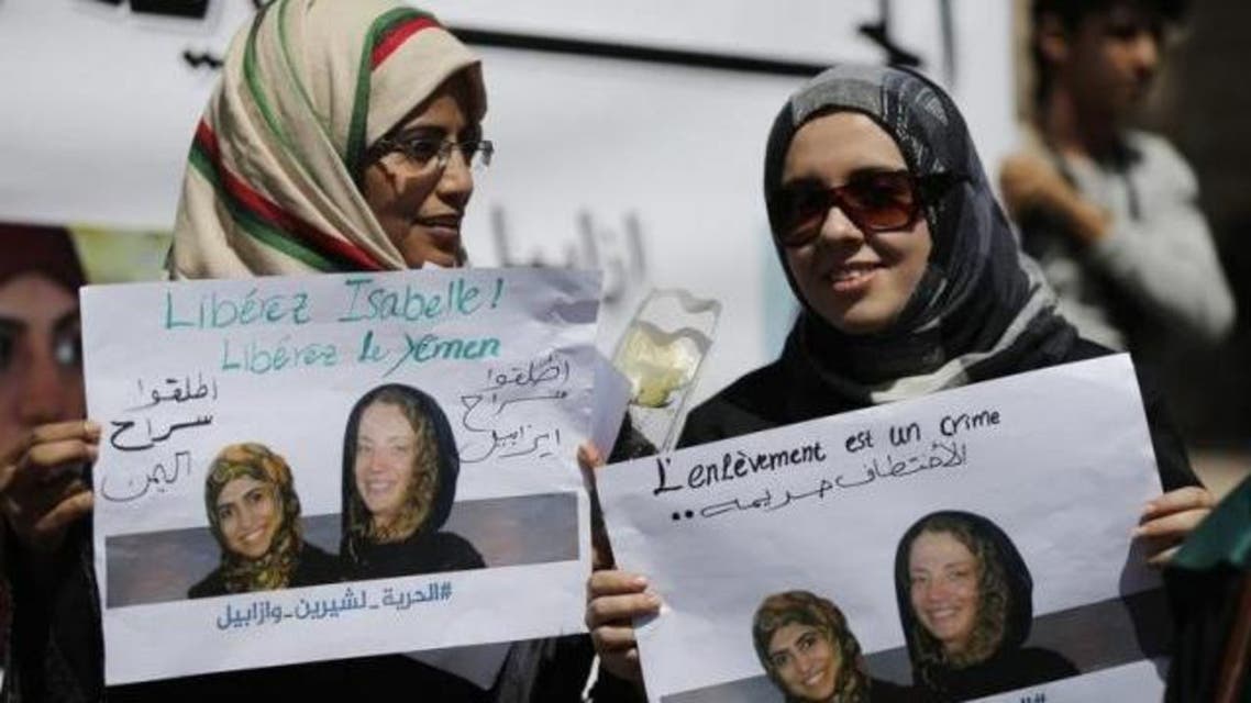 Women hold posters of Frenchwoman, Isabelle Prime (R) and her Yemeni translator Shereen Makawi during a protest to demand their release in Sanaa March 9, 2015. Reuters/Khaled Abdullah