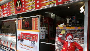 In this Wednesday, Aug. 5, 2015 photo, Iran's fast food restaurant "Mash Donald's," a knock-off version of McDonald's, sells burgers and fries in western Tehran, Iran.  (AP)