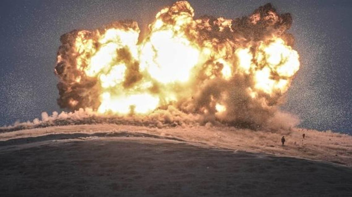 Militants stand just before explosion of an air strike near the Turkish border. (File photo: AFP)