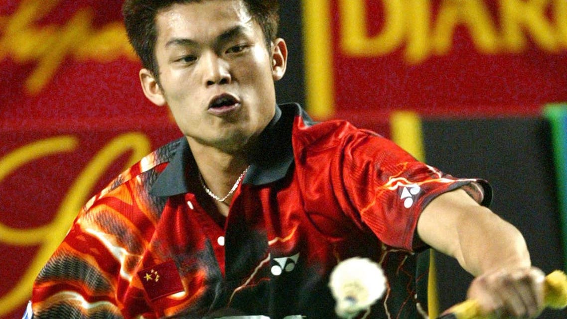 World's number one player Lin Dan, of China, returns the shuttlecock to Indonesia's Taufik Hidayat during their match at a men's single semi-final round of the Indonesia Open Badminton Championship in Jakarta, Indonesia, Saturday, Dec. 18, 2004. Taufik beat Lin, 15-5, 5-15, 11-15. (AP Photo/Dita Alangkara)