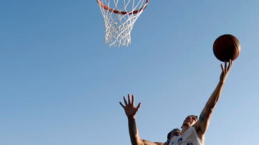  Bet Yosef of Israel shoots as Sergey Krasavtsev of Russia tries to block him during a basketball game for the 3X3 World basketball Championship in front of Zappeion hall in Athens, Saturday Aug. 25, 2012. (AP Photo/Kostas Tsironis)