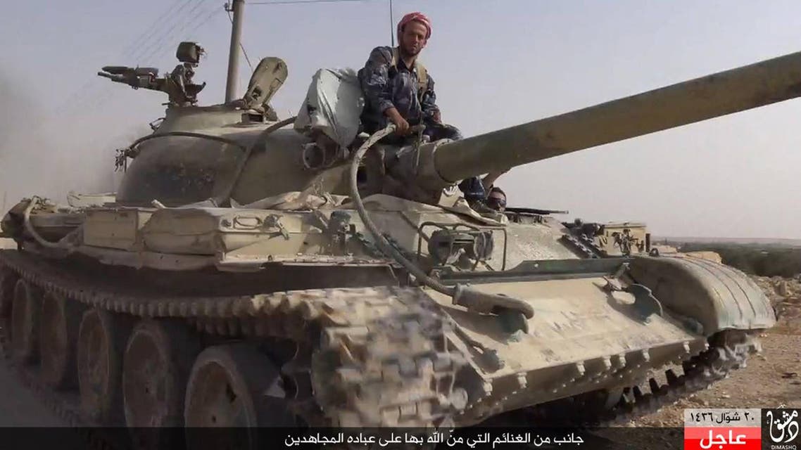 In this picture released Wednesday, Aug. 5, 2015 by the Rased News Network a Facebook page affiliated with Islamic State militants, an Islamic State militant sits on a tank they captured from Syrian government forces, in the town of Qaryatain southwest of Palmyra, central Syria. (File photo: AP)