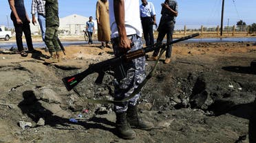 Army personnel look at the site of an explosion at an army checkpoint in Barsis, east of Benghazi. (File: Reuters)