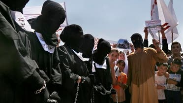 Yazidi Kurds protest against the Islamic State group's invasion on Sinjar city one year ago, in Dohuk, northern Iraq.