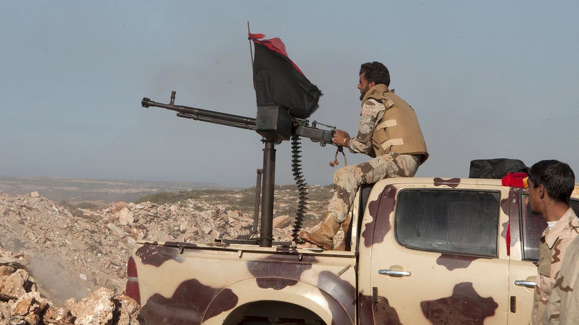 Members of the Libyan pro-government forces, aim a weapon during their deployment in the Lamluda area, southwest of the city of Derna , Libya June 16, 2015. Picture taken June 16, 2015. REUTERS/Stringer