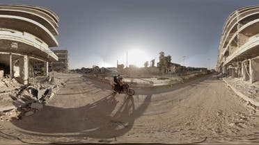 This image provided by Ryot shows a scene from a virtual reality short film of Syrians traveling on the street near the Aleppo Bridge for safety from the snipers targeting the condensed area in Syria. Three months after debuting VR footage filmed in Nepal after an earthquake devastated the country, Ryot is releasing an immersive three-minute short film on Tuesday, Aug. 11, 2015, that was captured on the war-torn streets of Aleppo, Syria. The film’s creator, Christian Stephen, said he captured the footage using six cameras and a 3D-printed gimbal. (Christian Stephen/Ryot via AP)