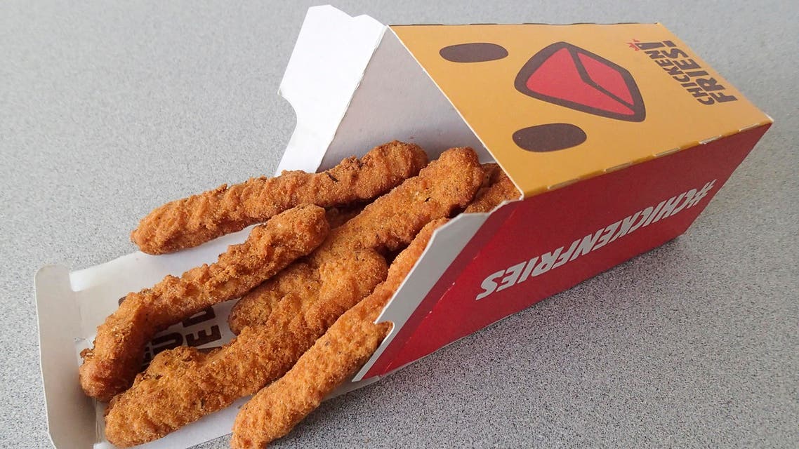 Chicken fries are posed for a photo at a Burger King restaurant, Tuesday, Aug. 11, 2015, in Orlando, Fla. Fans of Burger King's chicken fries may have the boy band One Direction and the website Buzzfeed to thank for the return of the skinny fried sticks. (AP Photo/John Raoux)