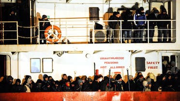    CTL4785 - Gallipoli, -, ITALY : (FILES) A file picture taken on December 31, 2014 shows immigrants waiting early aboard the Moldovan-flagged ship Blue SKy M. in the port of Gallipoli, in southeastern of Italy. A Syrian man, suspected of being part of the crew of the "Blue Sky M", an old ship which smuggled migrants in Italy in late December, was arrested in Germany on August 12, 2015, Italian investigators announced. Some 800 illegal migrants arrived in Italy on December 31 after their boat was intercepted while drifting towards the coast of Corfu. AFP PHOTO / NUNZIO GIOVE