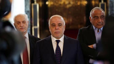 Iraqi Prime Minister Haider al-Abadi, center, holds a press conference before leaving to United States at Baghdad airport, Iraq, Monday, April 13, 2015. 