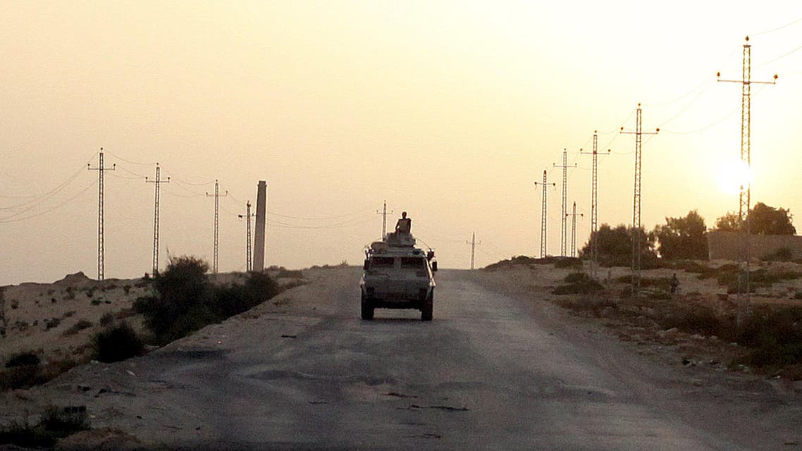 An Egyptian military vehicle is seen on the highway in northern Sinai, Egypt in this May 25, 2015 file photo. To match Special Report EGYPT-ISLAM/SINAI REUTERS/Asmaa Waguih/Files