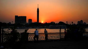 Egyptian men enjoy the sun setting over the Nile River in Cairo, Egypt, Wednesday, Aug. 5, 2015. (AP)